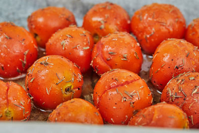 Cherry tomatoes are ready after baking in the oven for appetizer with ricotta cheese 