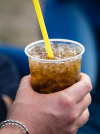 Close-up of hand holding drink