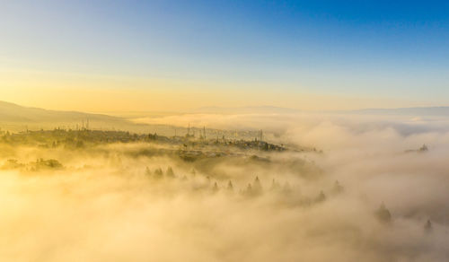 Aerial view of landscape against sky during sunset