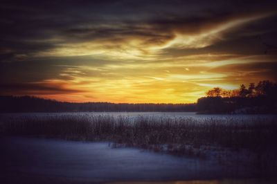 Scenic view of landscape at sunset