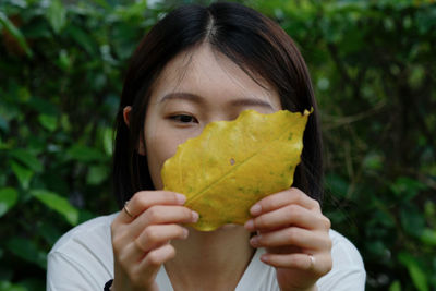 Close-up of woman holding fruit