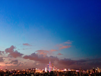 Illuminated buildings in city at night