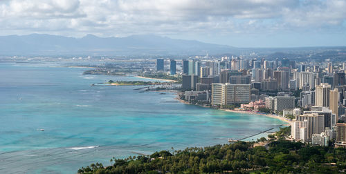 Vista on coastal city with azure waters, shot at diamond head lookout near honolulu, hawaii, usa