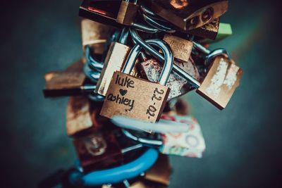 Close-up of various padlocks hanging outdoors