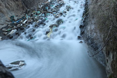 Scenic view of waterfall in sea