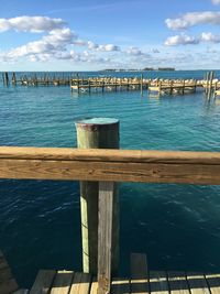 Pier over sea against sky