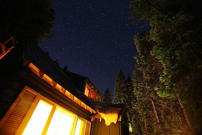 Low angle view of illuminated building at night