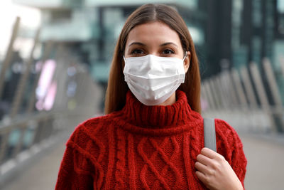 Portrait of beautiful young woman wearing mask