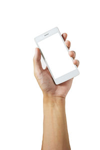 Midsection of person holding smart phone against white background