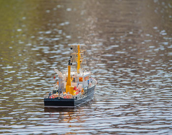 Remote controlled ship model is remote controlled on a lake