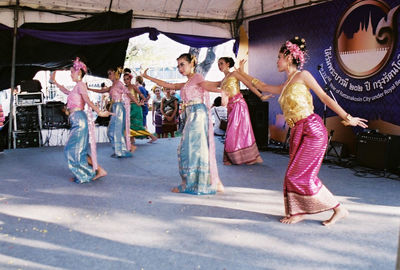 Group of people dancing at music concert