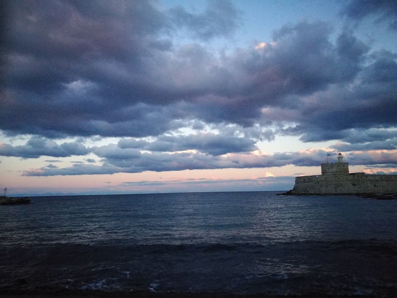 sea, cloud - sky, sunset, horizon over water, sky, dramatic sky, beauty in nature, scenics, outdoors, nature, cloudscape, travel destinations, no people, awe, beach, romantic sky, storm cloud, water, thunderstorm, architecture, day