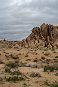 Rock formations on landscape against sky