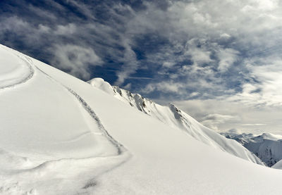 Snow covered mountain against sky