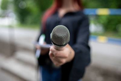 Close-up of man holding camera