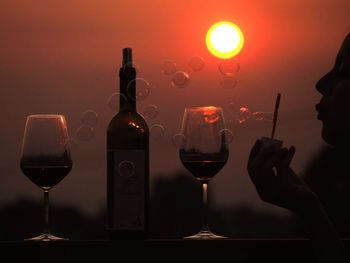 Close-up of wine glasses on table