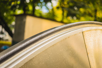 Close-up of wet railing