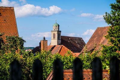 Panoramic view of trees and buildings against sky