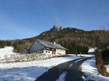 Scenic view of snow covered mountain against sky