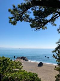 Scenic view of sea against clear blue sky