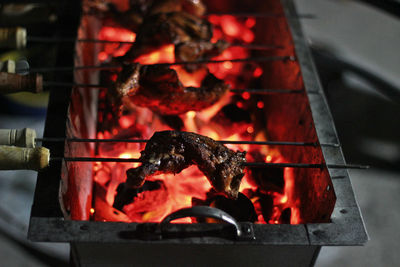 Close-up of meat on barbecue grill