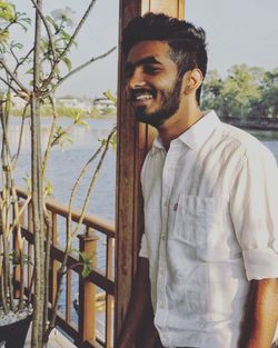 Portrait of young man standing outdoors