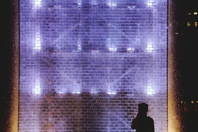 Man standing by window