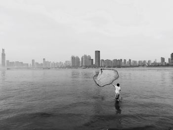 Man fishing in the city