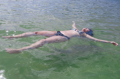 High angle view of man swimming in lake