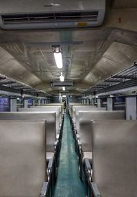 Empty illuminated underground walkway in building