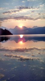 Scenic view of lake at sunset