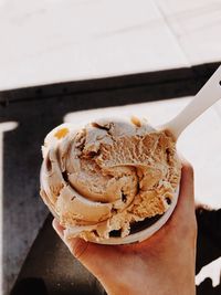 Close-up of hand holding ice cream