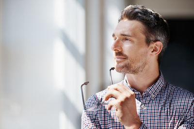 Portrait of young man looking away