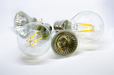 Close-up of glass jar on white table