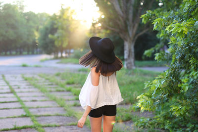 Rear view of woman walking in park