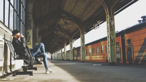 Side view of man in train