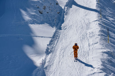 Person skiing on snowcapped mountain