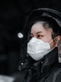 Close-up portrait of woman at night