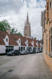 Street amidst buildings in city against sky