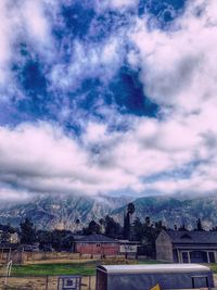 Scenic view of town against sky