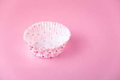 Close-up of cupcakes against pink background