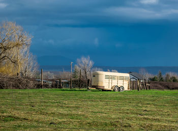 Trailer on grassy field