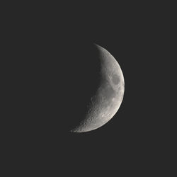 Low angle view of moon against clear sky at night