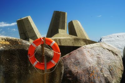 Low angle view of cross against sky