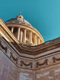 Low angle view of building against blue sky