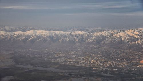 Scenic view of snowcapped mountains against sky