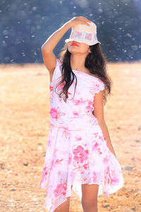 Woman standing on field