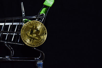 Close-up of wine glass against black background