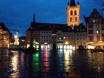 Reflection of illuminated buildings in water