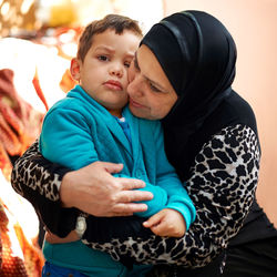 Grandmother embracing grandson